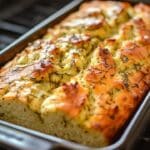 This Dill Pickle Bread is a unique and flavorful loaf with a tangy twist, perfect for pickle lovers. It’s moist, slightly tangy, and pairs well with savory spreads or can be enjoyed on its own.