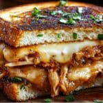 This BBQ Chicken Grilled Cheese Sandwich combines tender BBQ chicken, melty Havarti cheese, and garlic buttered bread for an irresistible, comforting meal. Perfect for lunch or dinner, this sandwich is sure to be a hit!