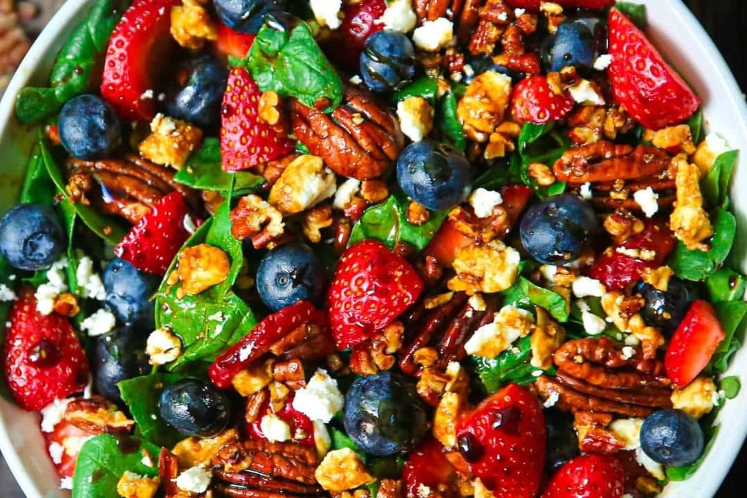 This Strawberry Spinach Salad is a light, refreshing dish packed with sweet strawberries, fresh spinach, juicy blueberries, and tangy feta cheese. Toasted pecans add a crunchy texture, while a homemade balsamic glaze brings everything together for a perfect balance of flavors.