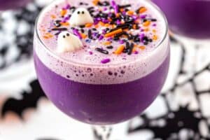 This Witch's Brew Punch recipe is a fun and spooky Halloween drink made with grape soda, lemonade, and rainbow sherbet. Perfect for parties, it's colorful, fizzy, and easy to make!