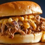 Tender and flavorful pulled pork, slow-cooked with root beer and spices, then smothered in your favorite barbecue sauce and served on soft hamburger buns. A perfect, easy-to-make dish for gatherings or family meals!