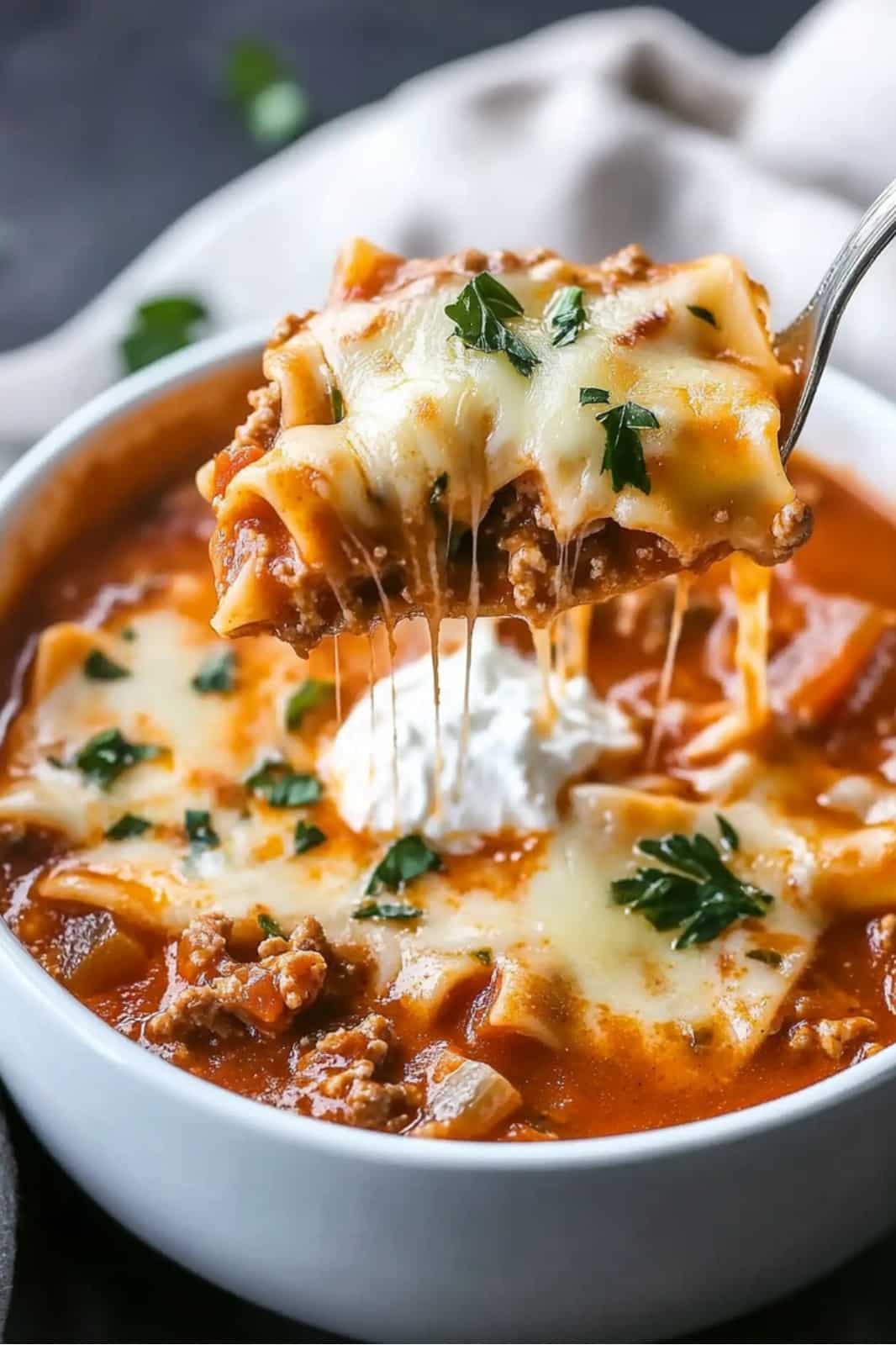 This Easy Lasagna Soup recipe is a hearty, one-pot meal! Made with ground beef, lasagna noodles, and a rich tomato broth, it's perfect for a quick and comforting weeknight dinner. Ready in 50 minutes!