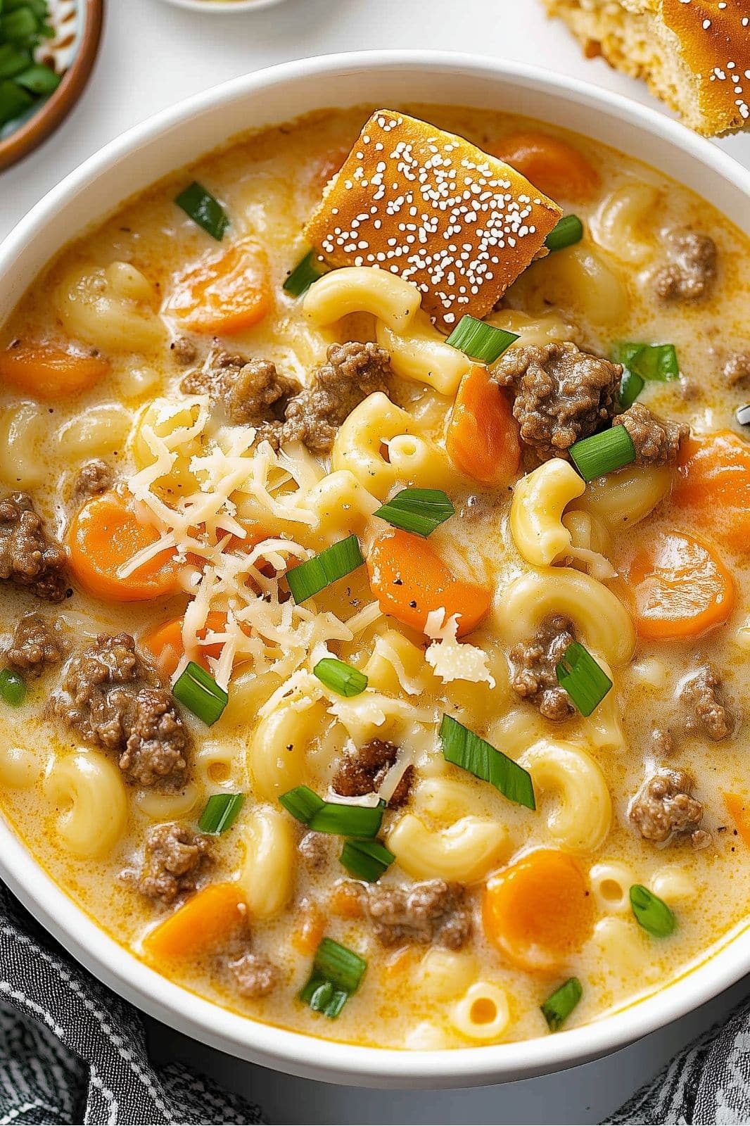 This hearty, cheesy soup combines all the flavors of a classic cheeseburger with tender macaroni. It's an easy, one-pot meal that's perfect for busy weeknights, offering warmth and comfort without the use of Velveeta!