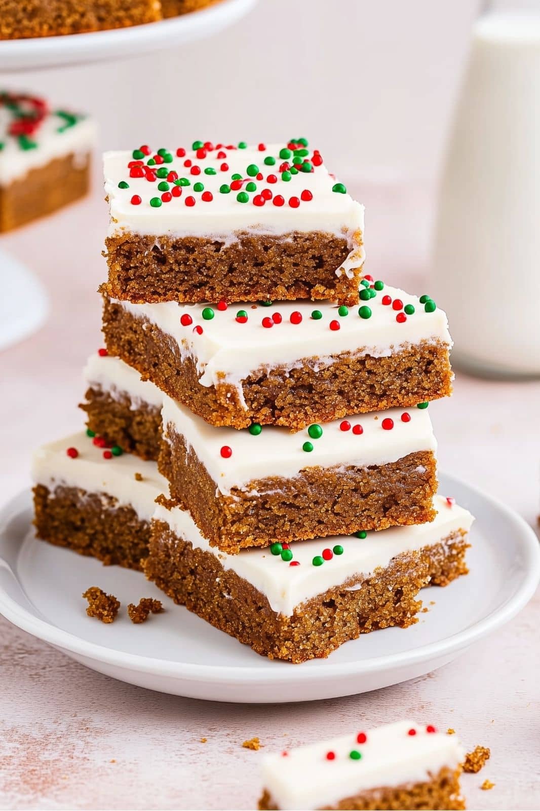 These Chewy Gingerbread Bars Recipe topped with cream cheese frosting are the perfect holiday treat! Full of warm spices like cinnamon, ginger, and cloves, these easy-to-make bars are a festive delight for any Christmas gathering. Ready in just over an hour!
