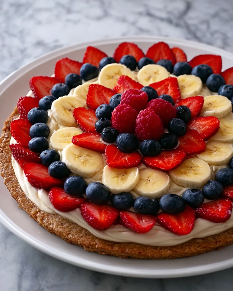 Oat and Yogurt Fruit Pizza Recipe 6 The image shows a close-up of a slice of fruit-topped dessert being lifted from a white plate. The dessert has three layers: the bottom layer is a thick, brown, soft-looking base with a crumbly texture; the middle layer is a creamy white spread evenly on top; and the top layer is made of fresh fruit, including sliced strawberries that are bright red, banana slices that are pale yellow, deep red raspberries, and dark blue blueberries scattered across the surface. The white plate full of the dessert sits on a background with a white marbled texture. A black-handled spatula holds the slice in the foreground. Photo taken with an iphone --ar 4:5 --v 7