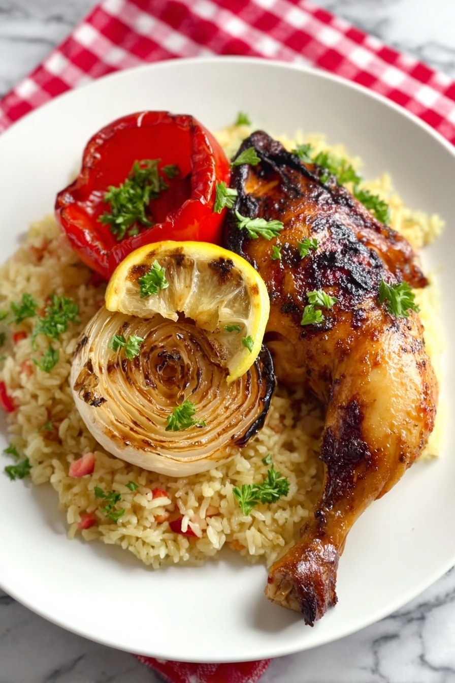 On a white plate, there is a bed of light yellow rice mixed with small red and green bits. On top of the rice, there is a grilled chicken leg with a shiny, golden-brown skin. A slice of lemon sits on the chicken, with a few green parsley leaves on the lemon and chicken. To the side, there is a grilled slice of red pepper and a round grilled onion with grill marks. The plate is placed on a white marbled surface with a red and white checkered cloth under it photo taken with an iphone --ar 2:3 --v 7 - Latin Mayo Roasted Chicken, Latin chicken marinade, flavorful roasted chicken, juicy Latin chicken recipe, easy Latin chicken dinner