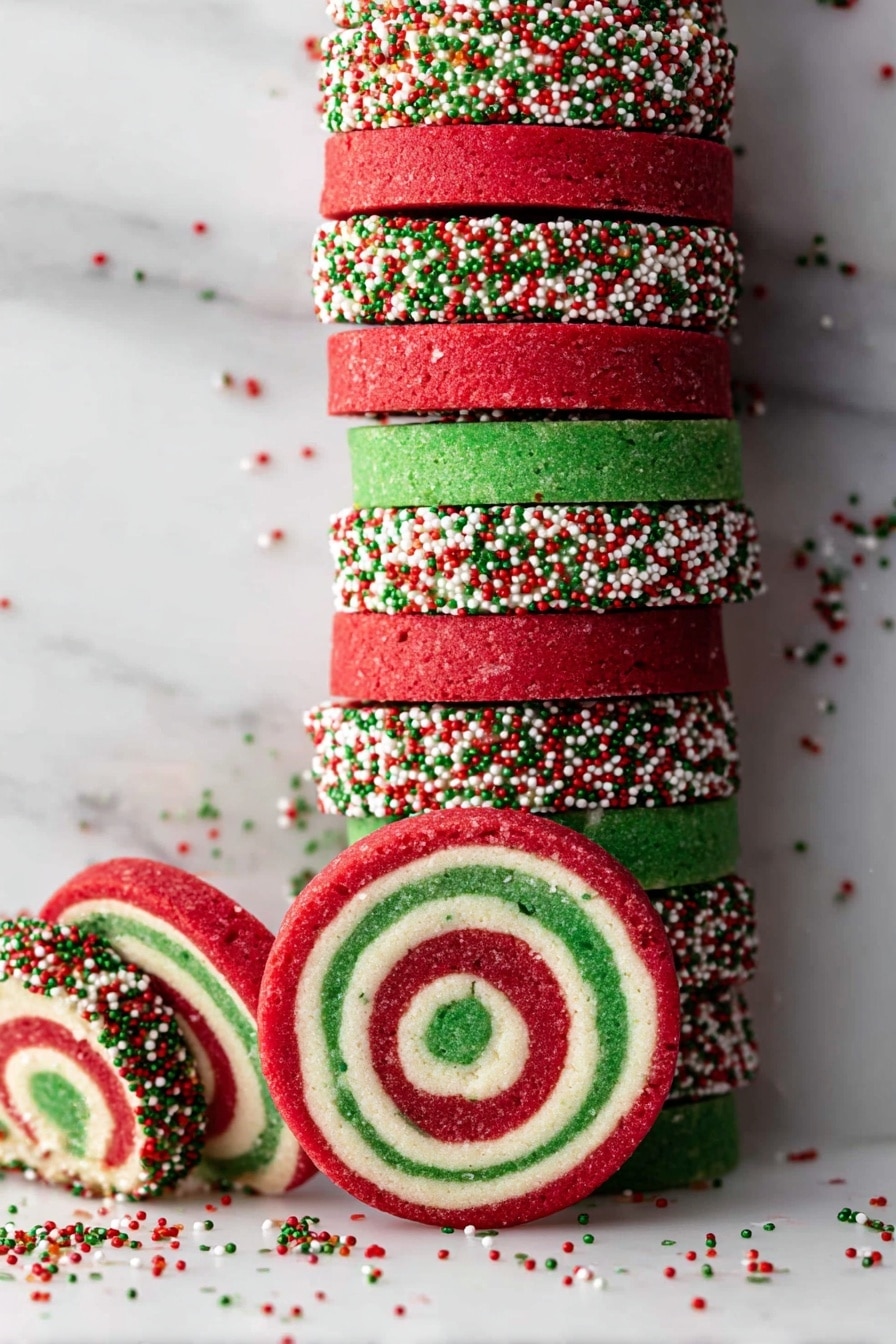 The image shows a stack of round swirl cookies with three colors in each cookie: red on the outside, a green spiral in the middle, and a white layer between them. The edges of the cookies are covered in small red, green, and white round sprinkles, some of which have scattered on the white marbled surface below. The cookies are neatly stacked vertically in the center with a few lying flat around the base. The overall look is festive and bright with clear contrast between the layers. Photo taken with an iphone --ar 2:3 --v 7 - Colorful Christmas Pinwheel Cookies, festive holiday cookies, colorful holiday cookie recipes, Christmas cookie ideas, easy holiday cookie recipes