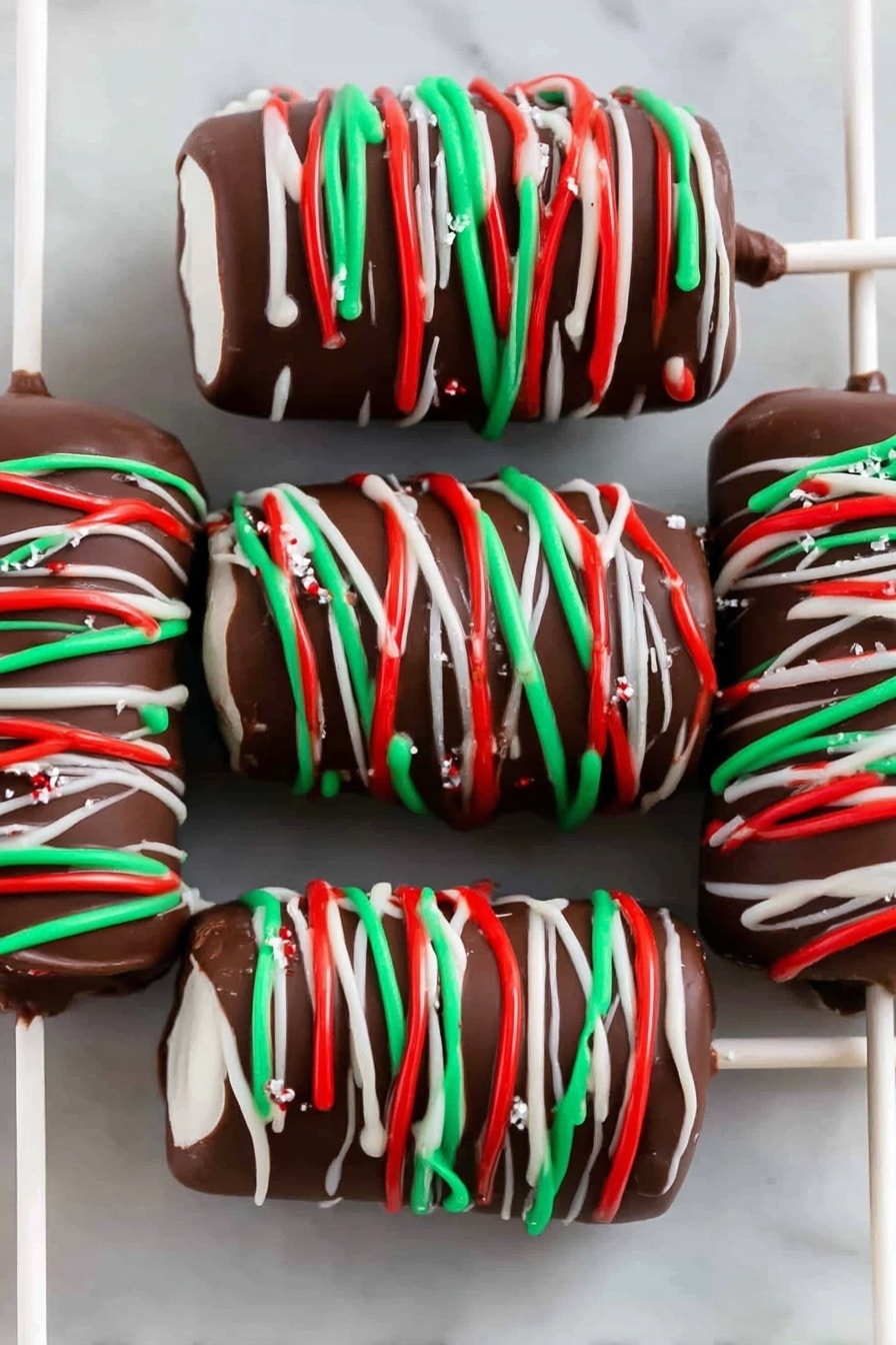 Christmas Marshmallow Pop Recipe 6 The image shows six chocolate-covered marshmallows on white sticks, stacked in a row on a white rectangular plate set on a white marbled surface. Each marshmallow skewer has three white marshmallows coated fully in dark brown chocolate, with festive thin lines of red, green, and white icing drizzled around them in a spiral pattern. The plate is placed close to colorful red, green, and white felt snowflake decorations in the background. The overall look is festive and colorful with smooth chocolate and bright icing colors. photo taken with an iphone --ar 2:3 --v 7 - Christmas Marshmallow Pops, holiday marshmallow treats, festive marshmallow desserts, easy Christmas snacks, colorful holiday candies