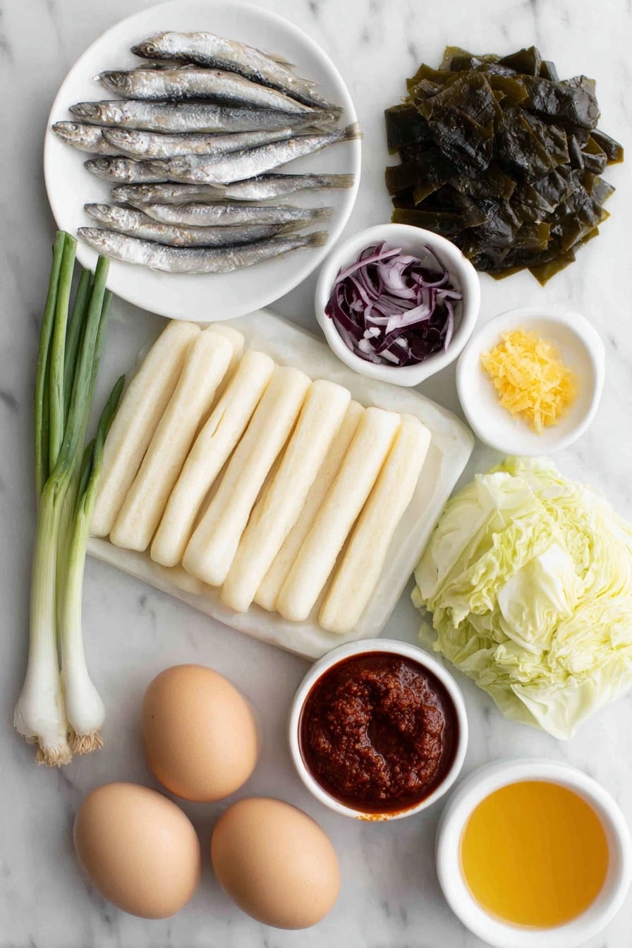 Flat lay of fresh tteokbokki rice cakes, rectangular pale white rice cakes about 3 inches long arranged neatly; two rectangular sheets of beige fish cake cut into strips; a small pile of roughly chopped green cabbage leaves with fresh vein details; two whole scallions with bright green tops and white bulbs; a small mound of minced raw garlic cloves; a few medium dried anchovies with silvery scales; a square piece of dried kelp with a dark green textured surface; thin slices of pale purple onion; a small white ceramic bowl filled with vibrant red gochujang paste; a small white ceramic bowl holding bright red finely ground gochugaru powder; a small white ceramic bowl containing dark brown soy sauce; a small white ceramic bowl with golden corn syrup; two whole uncracked boiled eggs with smooth brown shells placed side by side, all items arranged with perfect symmetry and balanced proportions, placed on a clean white marble surface, soft natural light, photo taken with an iPhone, professional food photography style, fresh ingredients, white ceramic bowls, no bottles, no duplicates, no utensils, no packaging --ar 2:3 --v 7 --p m7354615311229779997 - Spicy Tteokbokki Rice Cakes, Korean Tteokbokki, Spicy Rice Cake Recipe, Chewy Tteokbokki, Korean street food