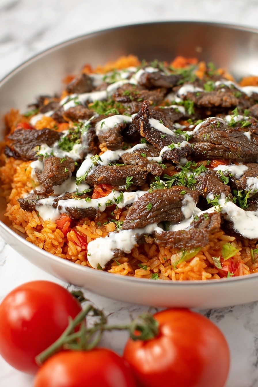 Steak and Queso Rice Recipe 6 The image shows a white bowl filled with two main layers: the bottom layer is orange-red rice mixed with small bits of vegetables, creating a textured base, and the top layer consists of dark brown, grilled beef strips scattered evenly over the rice. A light drizzle of white sauce is spread across the beef and rice, and small green herbs are sprinkled on top, adding a fresh contrast. In the foreground, on the white marbled surface, there are two small red tomatoes with green stems, slightly out of focus. Photo taken with an iphone --ar 2:3 --v 7 - Steak and Queso Rice, steak and queso rice, spicy steak and rice skillet, easy steak and queso dinner, comforting beef and cheese rice