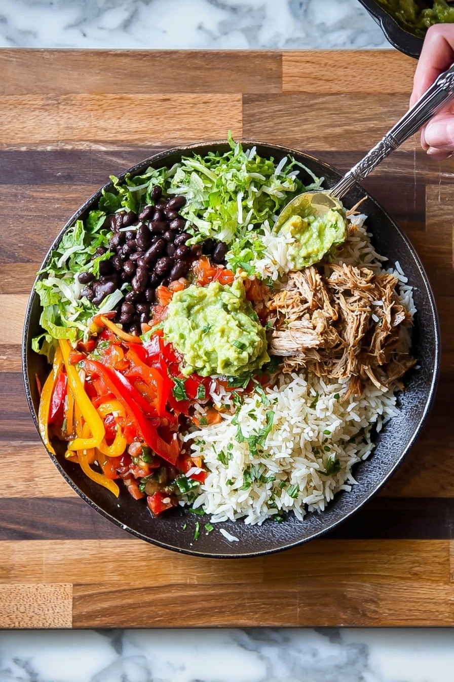 This image shows a white bowl filled with a colorful layered salad on a white marbled surface. The bottom layer is chopped green lettuce, topped with a layer of white rice. On top of the rice, there is a spread of dark brown shredded meat placed on one side. Next to the meat, there are yellow corn kernels and black beans mixed with chopped red tomatoes, onions, and green herbs. Shredded white cheese is sprinkled over the vegetables. A large dollop of green guacamole sits on one side of the bowl, and a white creamy sauce is placed beside it. A silver spoon is resting on the edge of the bowl. A white and black striped cloth is beside the bowl. Photo taken with an iphone --ar 2:3 --v 7 - Carnitas Burrito Bowl with Cilantro Lime Rice, Mexican-inspired rice bowl, Easy carnitas recipe, Healthy burrito bowl ideas, Flavorful rice and meat combination