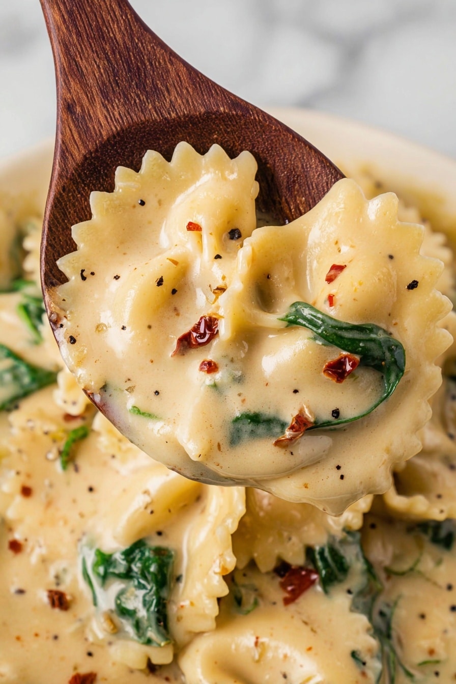 Slow Cooker White Lasagna Soup Recipe 6 The image shows a white bowl filled with creamy pasta soup placed on a white plate, sitting on a wooden surface. The soup has three main layers: a thick cream base with a pale yellow color with red and green bits, soft pasta pieces with wavy edges floating within, and whole spinach leaves adding bright green contrast. The top layer is sprinkled with grated cheese and fresh green parsley leaves. Around the bowl, there are loose pasta pieces, a sprig of parsley, and golden cutlery on a black and white checkered cloth. The background is a white marbled textured surface. Photo taken with an iphone --ar 2:3 --v 7 - Slow Cooker White Lasagna Soup, White Lasagna Soup, Easy White Lasagna Soup, Creamy Lasagna Soup Recipe, Comforting Soup Recipes