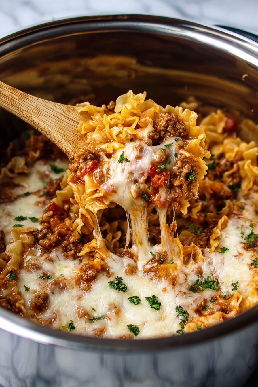 Instant Pot Lazy Lasagna Recipe 6 This image shows a close-up of a lasagna pasta dish in a metal pot. The dish has layers of ruffled pasta in light golden yellow, mixed with browned meat and chunks of red tomato sauce. Melted white and pale yellow cheese covers the top, stretching slightly as a wooden spoon lifts a portion. Small green bits of parsley are sprinkled over the dish for color. The pot’s inner surface has a shiny silver finish, and the background is a white marbled texture. photo taken with an iphone --ar 2:3 --v 7 - Instant Pot Lazy Lasagna, quick lasagna dinner, easy lasagna recipe, pressure cooker lasagna, weeknight lasagna