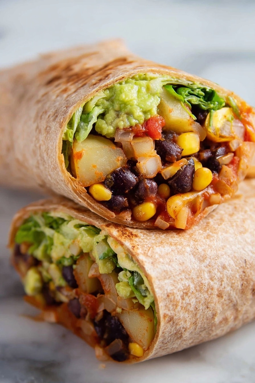 A close-up view of a burrito sliced in half, showing three main layers inside a lightly toasted whole wheat tortilla. Inside, the bottom layer is a mix of black beans, yellow corn kernels, diced light brown cooked potatoes, and some tomato chunks, all mixed with a reddish sauce. Above that is a layer of creamy green mashed avocado and shredded bright green lettuce with small bits of red tomato. The burrito sits on a white marbled surface, with the uncut half slightly blurred behind it. photo taken with an iphone --ar 2:3 --v 7 - Vegan Black Bean Rice Burritos, vegan burritos, vegetarian burrito recipes, plant-based burrito ideas, quick vegan lunch