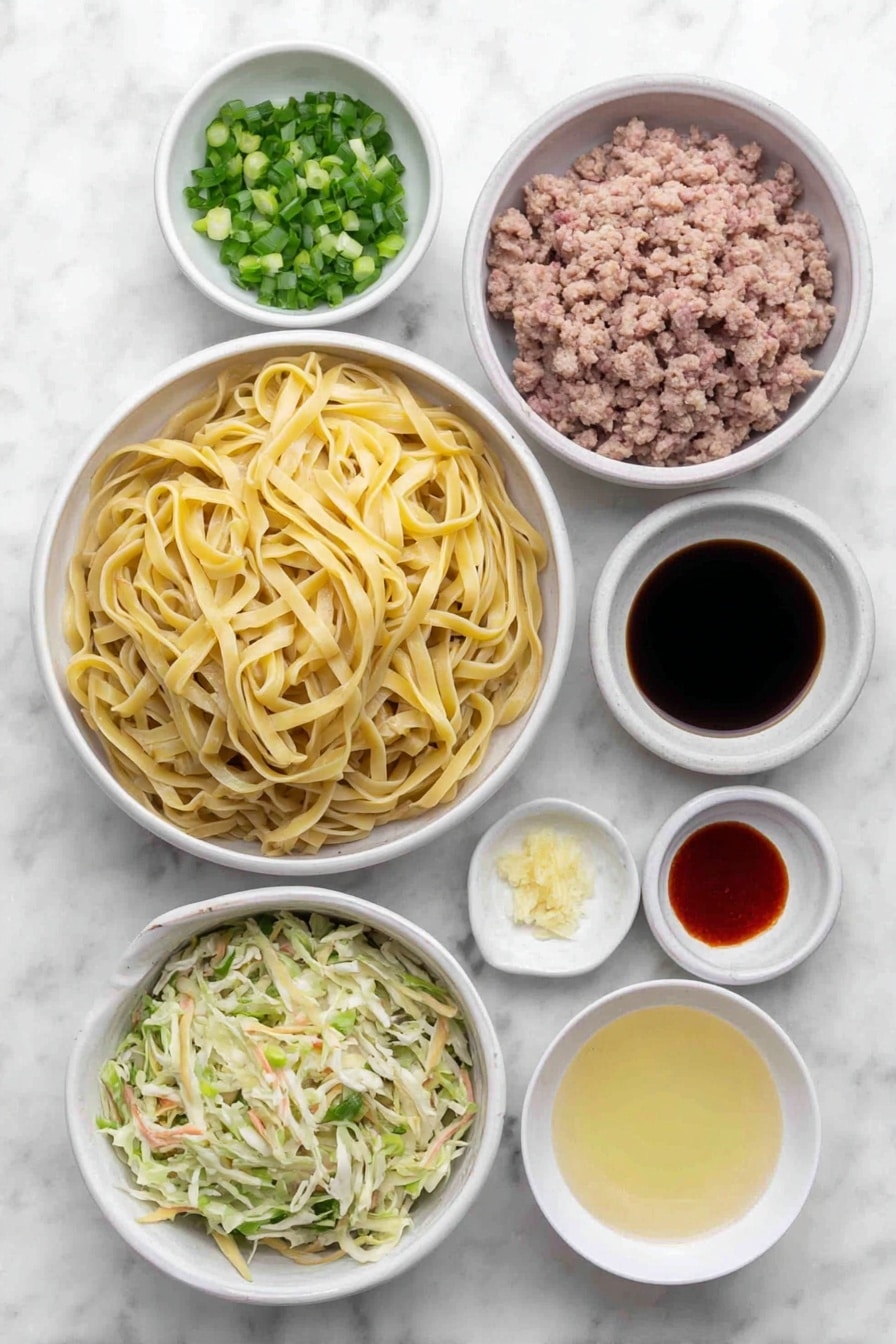 Potsticker Noodle Bowl with Pork and Greens Recipe 7 Flat lay of cooked wide lo mein noodles, a small white bowl of peanut oil, a mound of fresh ground pork, a small white bowl filled with sliced green onions, a small white bowl of low-sodium chicken broth, a small white bowl of mirin, a small white bowl of dark soy sauce, a small white bowl with minced garlic, a small white bowl containing freshly grated ginger, a small white bowl of sesame oil, a small white bowl with sriracha, and a fresh heap of coleslaw mix arranged symmetrically on simple white ceramic dishes, placed on a clean white marble surface, soft natural light, photo taken with an iPhone, professional food photography style, fresh ingredients, white ceramic bowls, no bottles, no duplicates, no utensils, no packaging --ar 2:3 --v 7 --p m7354615311229779997 - Potsticker Noodle Bowl with Pork and Greens, flavorful Asian noodle bowl, quick Asian pork recipe, healthy pork and greens stir-fry, easy weeknight noodle bowl