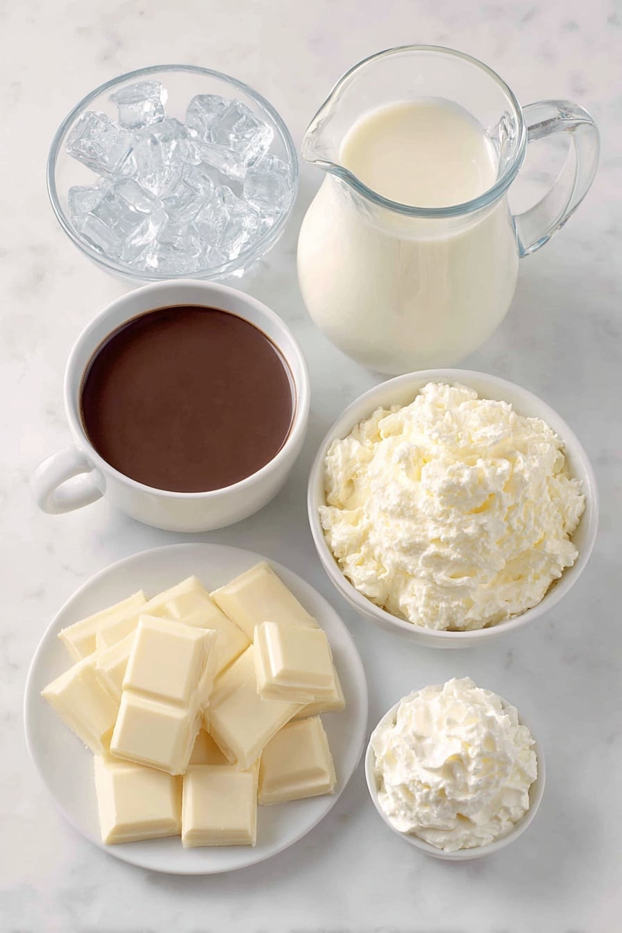 Iced White Chocolate Mocha Copycat Recipe 7 Flat lay of a small white ceramic bowl of rich dark espresso, a glass pitcher of fresh cold milk, a small white ceramic bowl filled with smooth white chocolate sauce, a handful of clear ice cubes neatly arranged, and a dollop of fluffy fresh whipped cream on a simple white ceramic dish, all placed on a clean white marble surface, soft natural light, photo taken with an iPhone, professional food photography style, fresh ingredients, white ceramic bowls, no bottles, no duplicates, no utensils, no packaging --ar 2:3 --v 7 --p m7354615311229779997 - Iced White Chocolate Mocha, White Chocolate Mocha Copycat, Starbucks White Chocolate Mocha, Homemade Iced Coffee Drinks, Easy White Chocolate Mocha