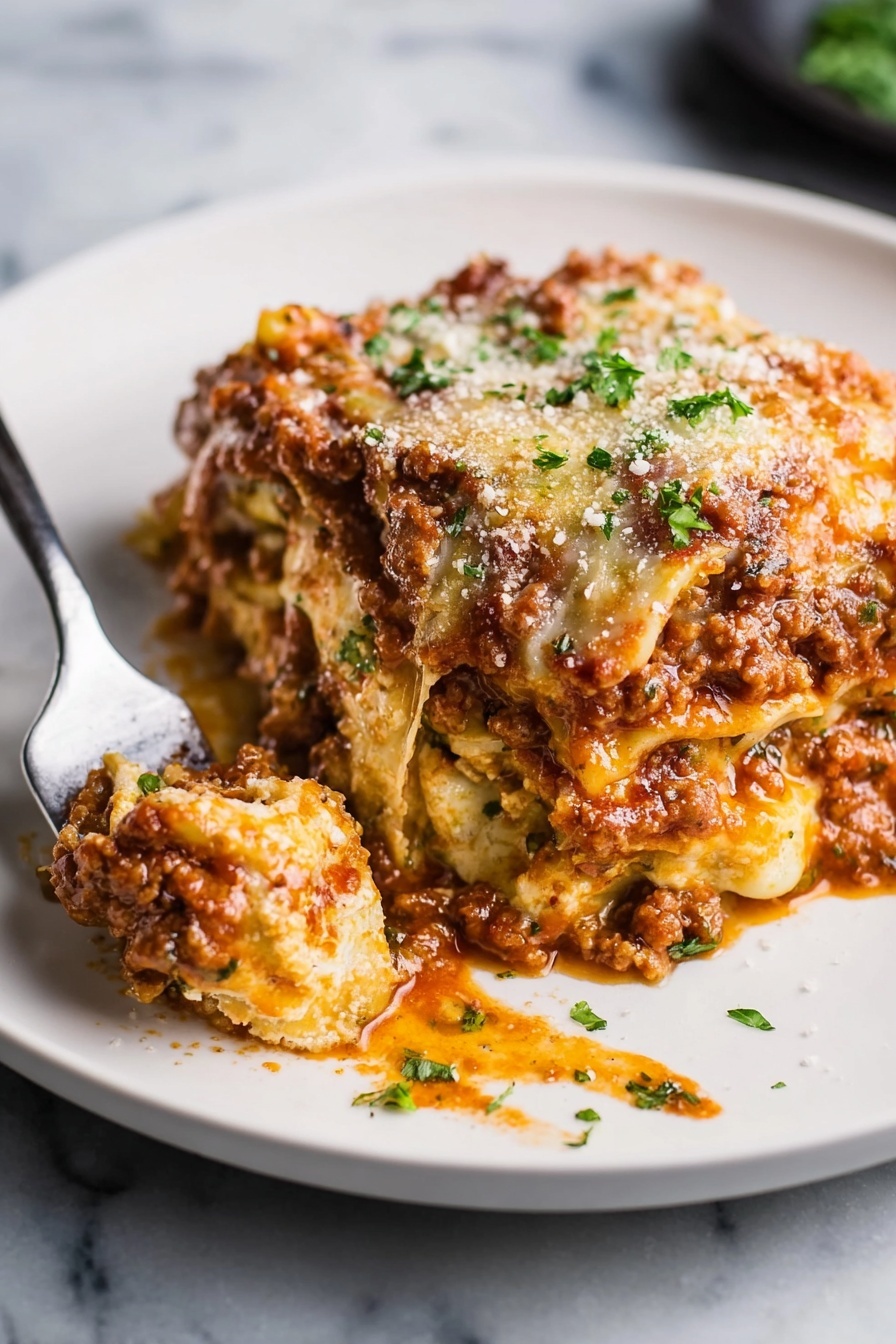 Easy No-Boil Lasagna Recipe 6 A white plate holds a thick slice of lasagna with about five visible layers; the bottom and middle layers show creamy white cheese sheets, while the layers between them are thick with rich, reddish-brown meat sauce textured with small bits of ground meat, topped with melted yellowish-orange cheese and sprinkled with grated pale cheese and fresh green parsley pieces. A silver fork rests on the plate, lifting a bite of the lasagna with sauce dripping. The plate sits on a white marbled surface. Photo taken with an iphone --ar 2:3 --v 7 - Easy No-Boil Lasagna, no-boil lasagna recipe, quick lasagna dinner, effortless lasagna, cheesy baked lasagna